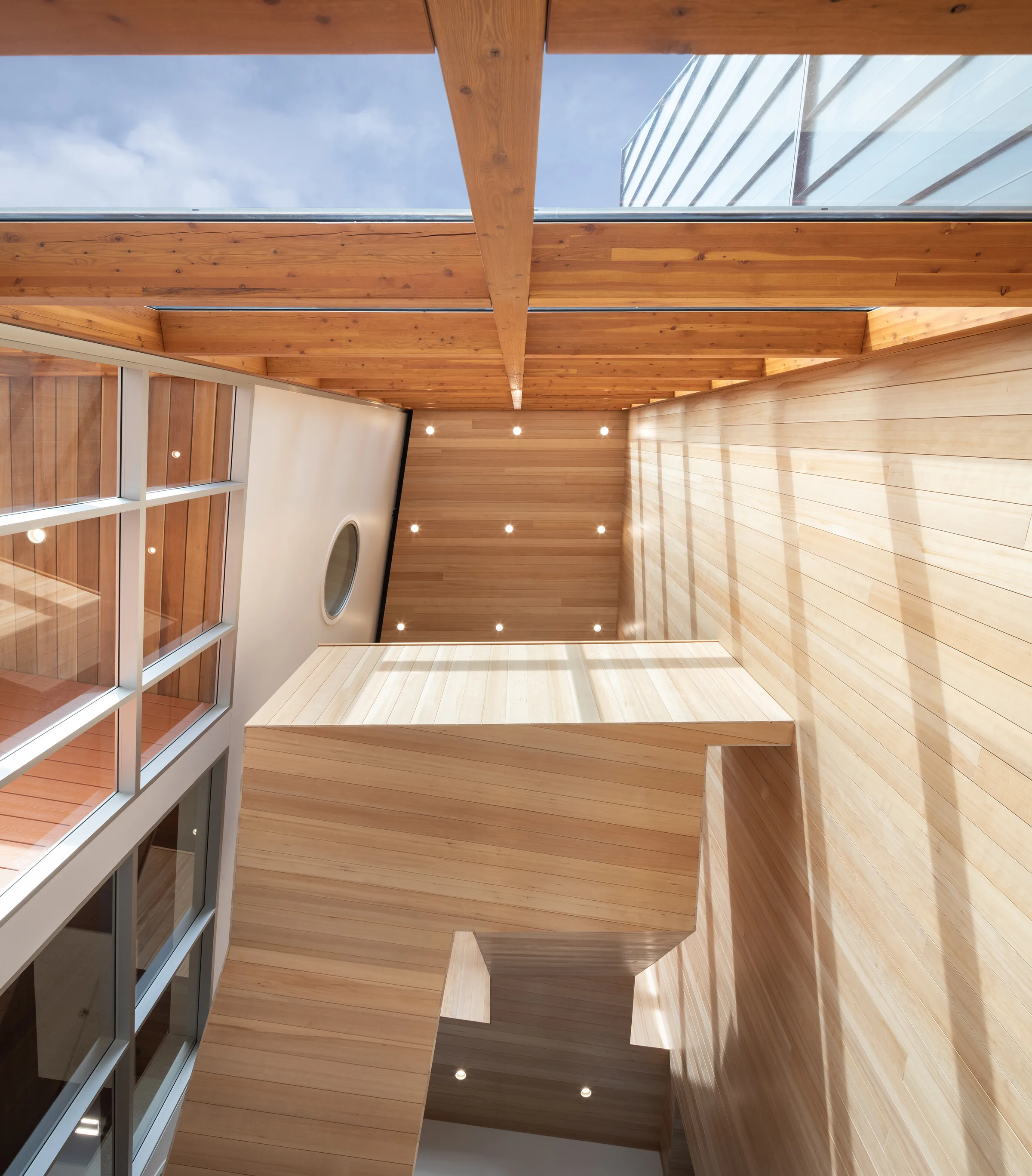 Ts'kw'aylaxw Community Centre. Looking up to suspended staircase.